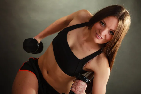 Woman exercising with dumbbells. — Stock Photo, Image