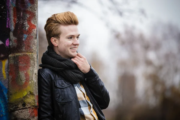 Fashion male portrait on graffiti wall — Stock Photo, Image