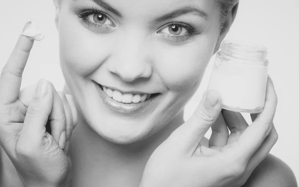 Woman applying cream — Stock Photo, Image