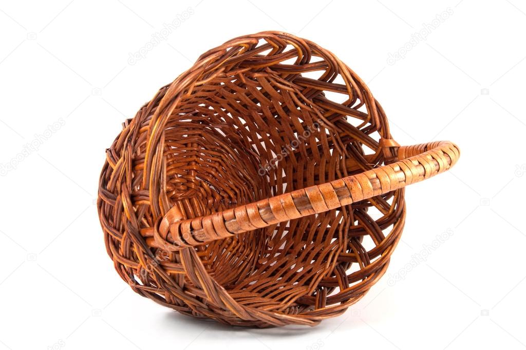 Empty wooden wicker basket on white background