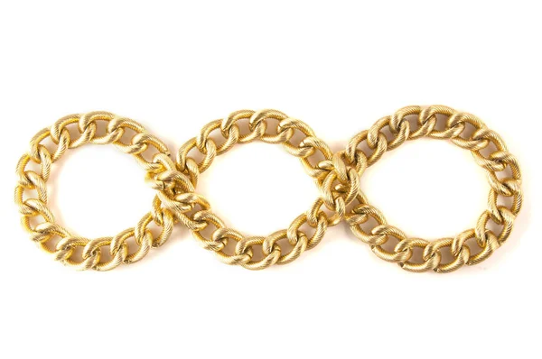 Golden chain of twisted rings. Isolated on white — Stock Photo, Image