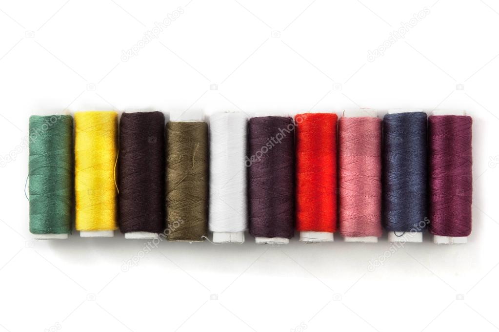 colorful sewing threads isolated on white background