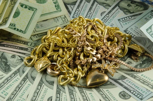 Dollars met goud op witte achtergrond Rechtenvrije Stockafbeeldingen