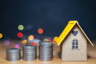 Bozuk para yığını, Yatırım mülkiyeti kavramı, yatırım riski ve emlak piyasasındaki belirsizlik üzerine mini ev.