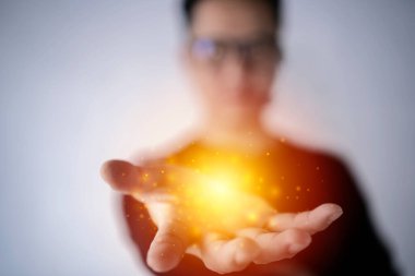 magic particles on the palms of a men, a stream of magical energy emanating from men hands