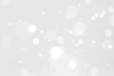 Beyaz ve gümüş soyut arkaplan arkaplan ve duvar kâğıdı Noel için bokeh ışıkları ile bulanık.