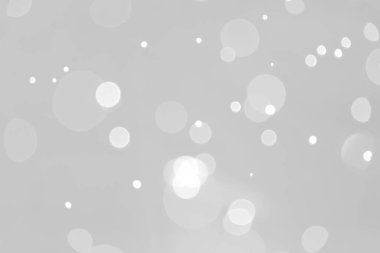 Bokeh Işığı 'ndan gelen gri ve beyaz Bokeh ışıkları. Arka plan doğa yaprağı ağacı, bayram parıltısı Bokeh Noel.