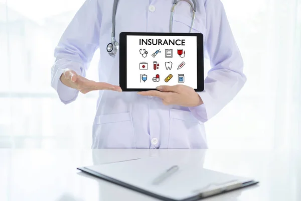 Doctor hand holding tablet with healthcare medical icons. Health insurance concept. Customer care, care for employees, life insurance and marketing segmentation