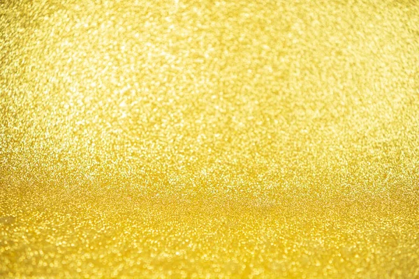 Lights on gold background. silver sparkle glitter bokeh abstract bright blur for merry christmas and happy new year celebration, gold texture background