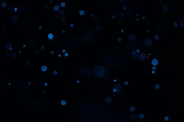 Abstrakcyjny Niebieski Bokeh Czarnym Tłem Prawdziwe Podświetlone Cząsteczki Pyłu Prawdziwym — Zdjęcie stockowe