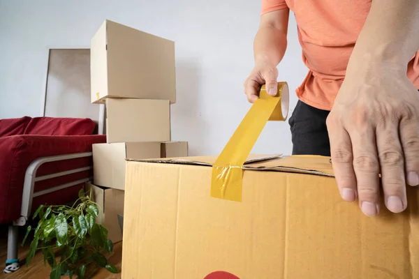 House Moving Concept Closeup Man Packing Cardboard Box Moving New — Φωτογραφία Αρχείου