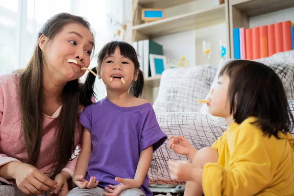 Loving Family Happy Mother Daughter Eating Crackers Home — Stock Photo, Image