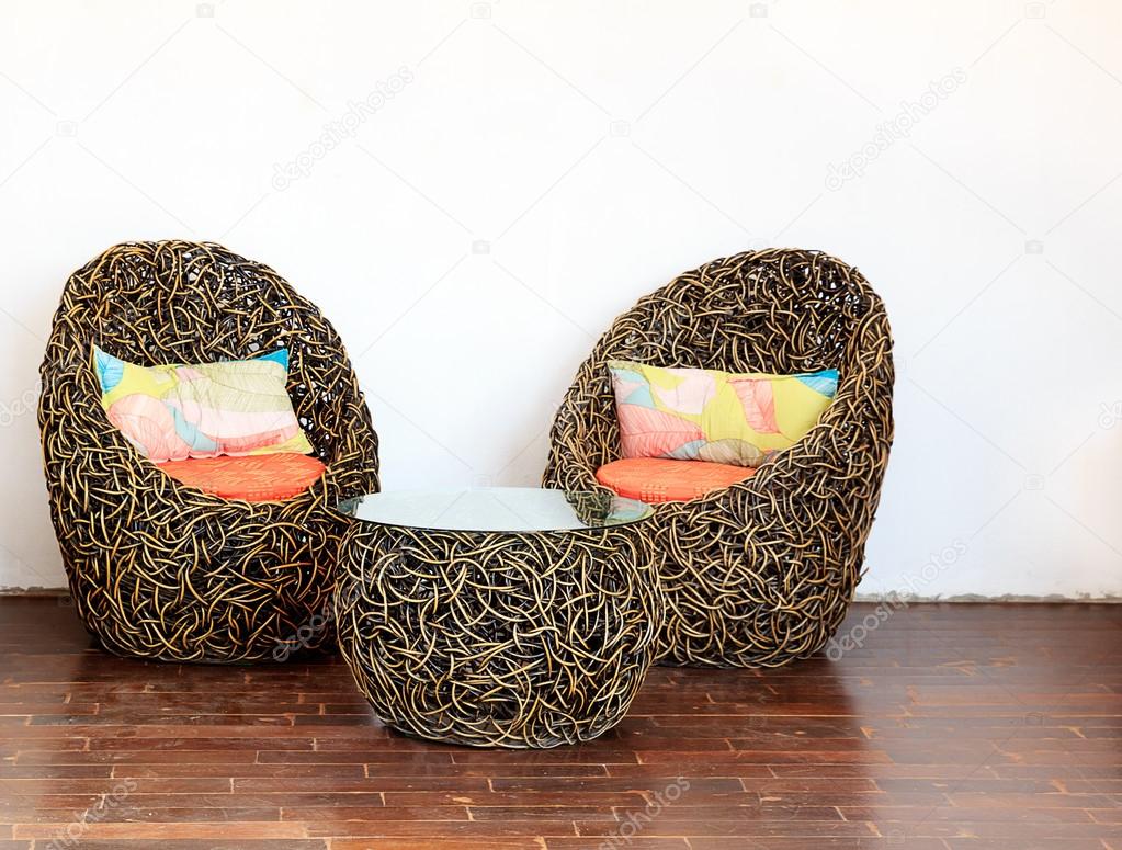 Round Wicker Chairs With Glass Table And Colorful Pillows Stock Round Wicker Chairs With Glass Table And Colorful Pillows Stock Photo