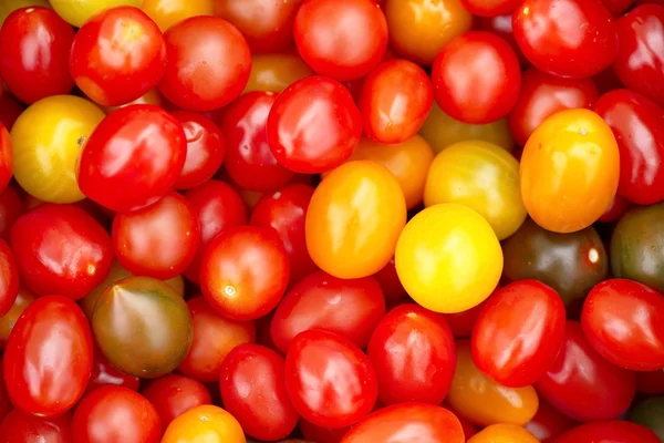 Different colorful cherry tomatoes market
