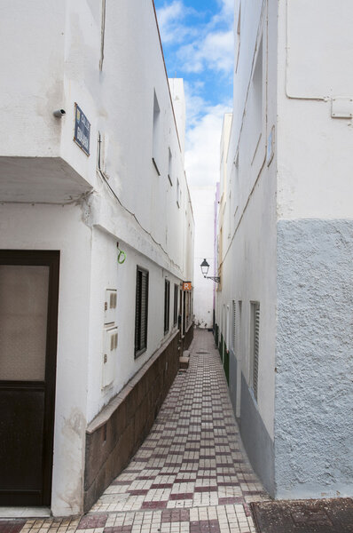 Modern white building with an alley