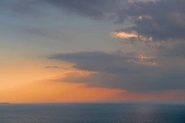 Landscape at sunset of clouds, sunbeams, and waters of Lake Michigan, Sleeping Bear Dunes National Lakeshore, Michigan, USA