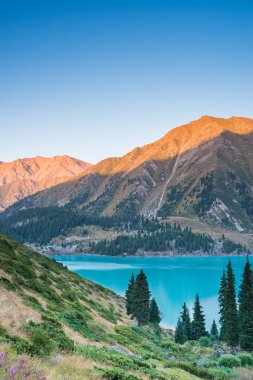 Highland Big Almaty Lake in the mountains of Trans-Ili Alatau near Almaty clipart