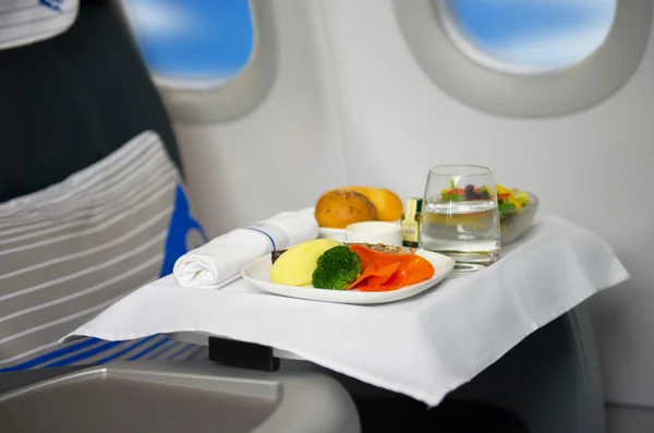 Lunch on board of airplane — Stock Photo, Image