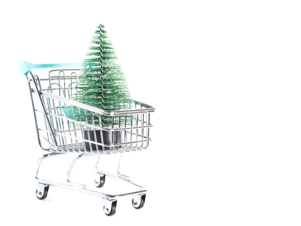 Small christmas tree in mini shopping cart — Stock Photo, Image