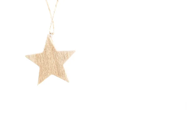 Wooden star christmas decoration hanging on white background — Stock Photo, Image