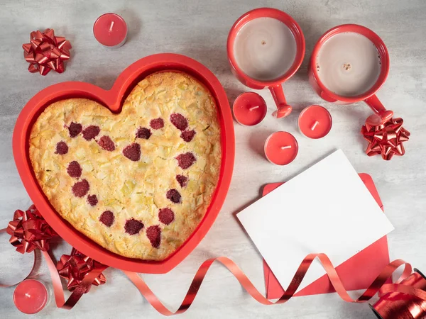 Heart shape cake silicon mould with hot drink cups and Valentine day decorations — Stock Photo, Image