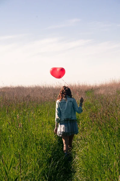 Woman with balloon — Stock Photo, Image