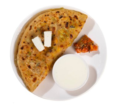 Indian breakfast dish paneer paratha serve with curd or chutney