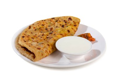 Indian breakfast dish paneer paratha serve with curd or chutney