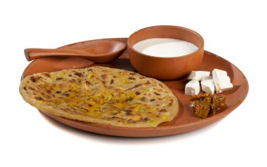 Indian breakfast dish paneer paratha serve with curd or chutney