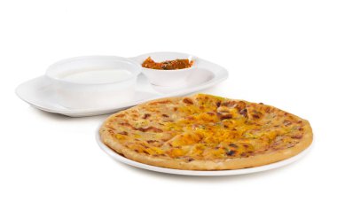 Indian breakfast dish paneer paratha serve with curd or chutney