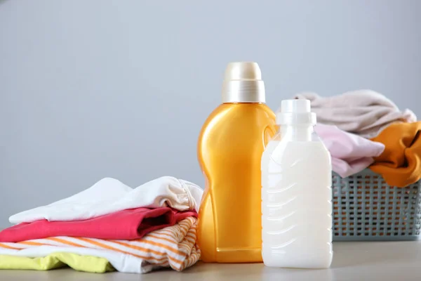 Laundry Detergent Bottles Clothes Table Household Chemicals High Quality Photo — Stock Photo, Image