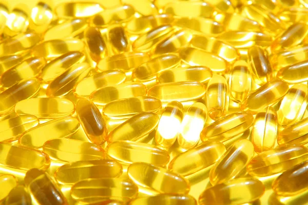 Omega 3 capsules close up. Fish fat. Background