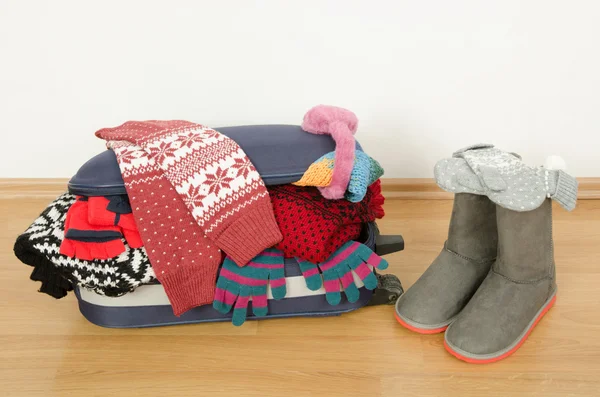 Winter luggage. Suitcase full of wither clothes. — Stock Photo, Image