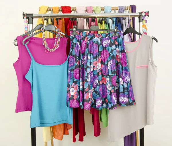 Cute summer outfits displayed on a rack. — Stock Photo, Image