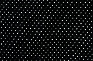 Siyah ve beyaz noktalar yün doku üzerinde kapat. 