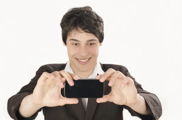 Gelukkig zakenman nemen van een foto van de selfie met zijn slimme telefoon. — Stockfoto