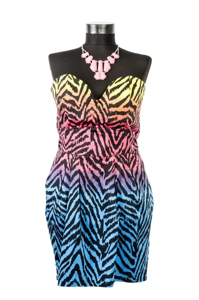 Colorful zebra pattern dress with matching necklace on a mannequin. — Stock Photo, Image