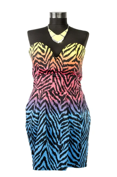 Colorful zebra pattern dress with matching necklace on a mannequin. — Stock Photo, Image