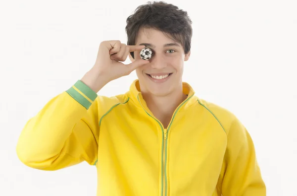 Young man with a small football ball. — Stock Photo, Image