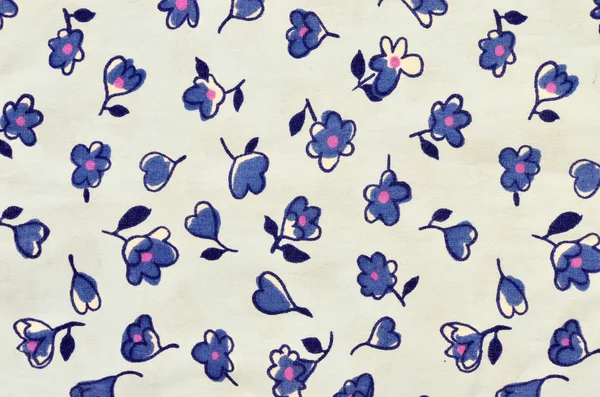 Floral pattern on blue fabric.