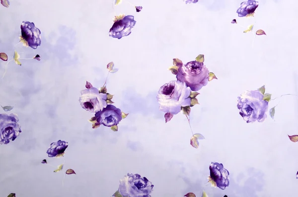 Floral pattern on purple fabric.