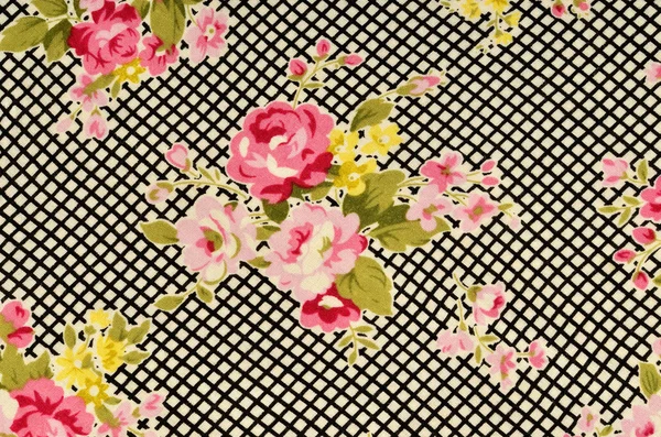 Pink roses on black and white stripe fabric. — Stock Photo, Image