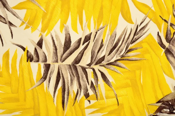 Tropiska bruna och gula löv mönster på tyg. — Stockfoto