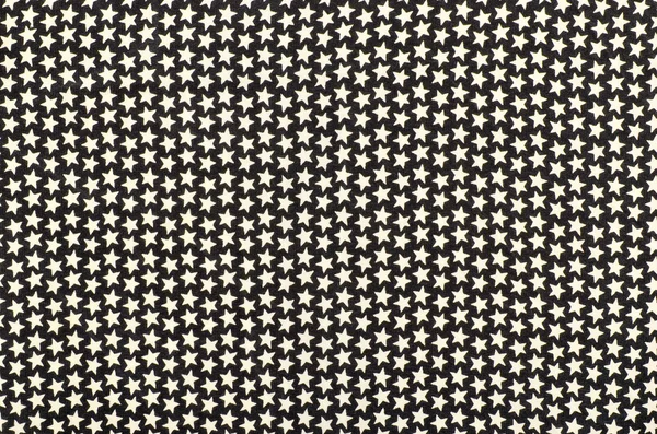 White five-pointed stars on black fabric. — Stock Photo, Image