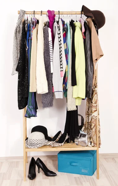 Close up on autumn winter clothes on hangers in a store. — Stock Photo, Image