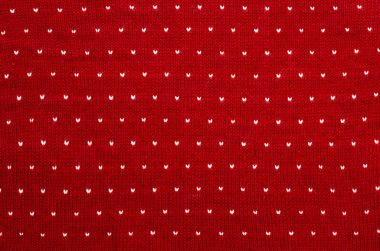 Beyaz ve kırmızı kalp noktalar yün doku üzerinde kapat.