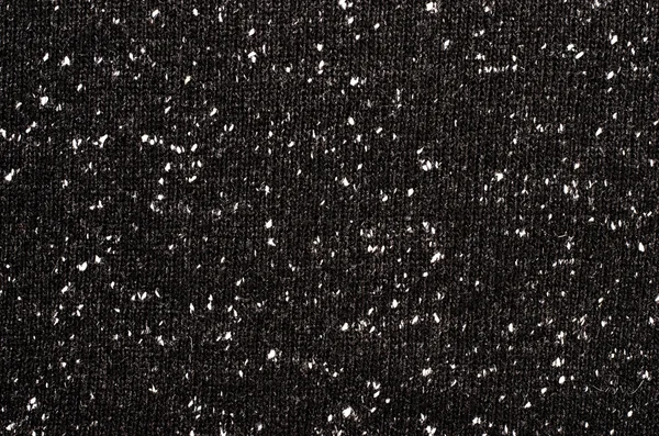 Close-up op zwarte en witte stippen wollen textuur. — Stockfoto