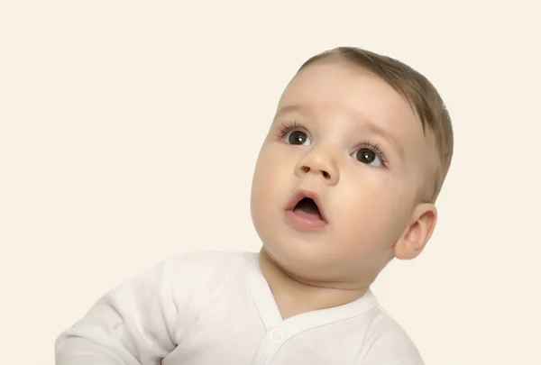 Cute baby boy looking up surprised. — Stock Photo, Image