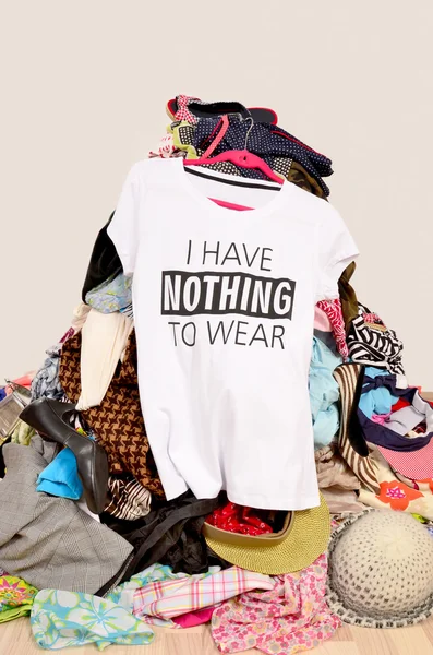 Big pile of clothes thrown on the ground with a t-shirt saying nothing ...