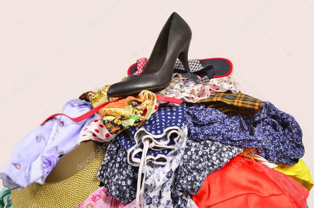 Close up on a big pile of clothes and accessories thrown on the